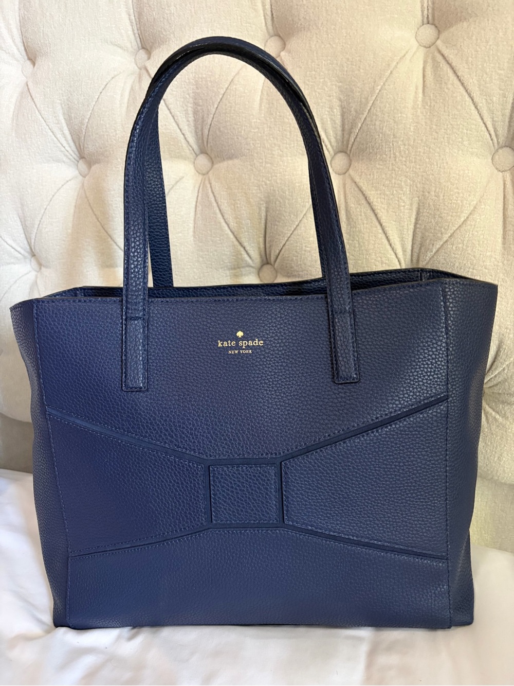 kate spade pebbled leather tote in navy with gold logo